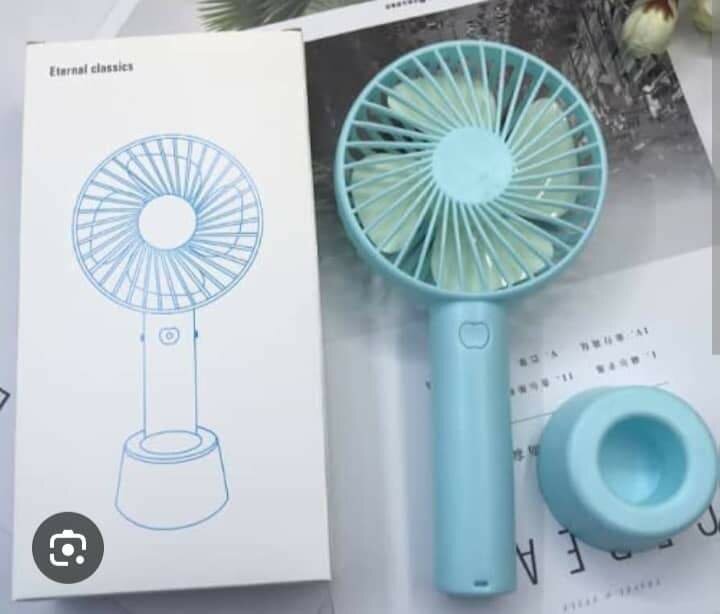 Stay Cool with a Portable hand Fan    Compact design  Powerf