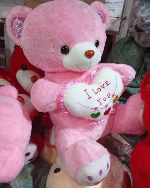 Ours en peluche rose avec cœur