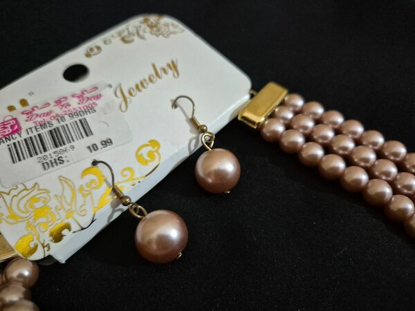 Necklace with small earrings.