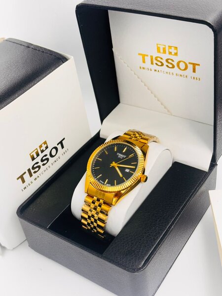 Montre Tissot en or avec bracelet métallique
