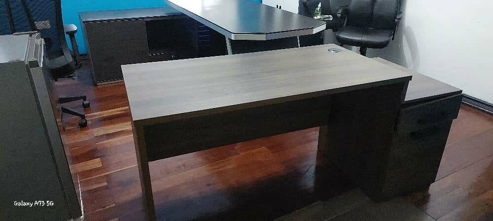 Medium sized varnished executive office table. Wooden brown