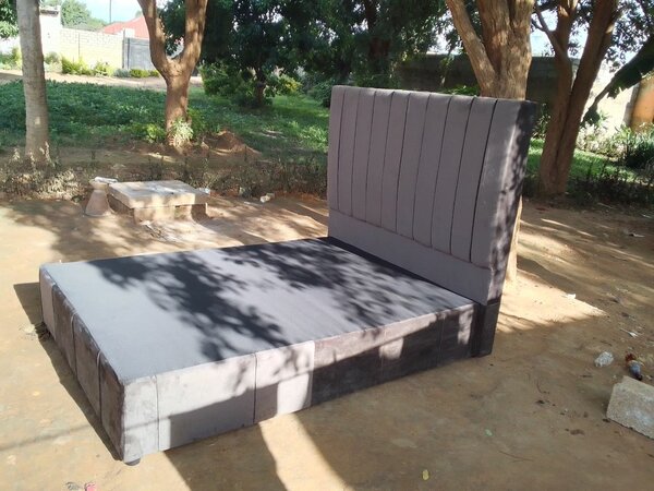 Gray double bed and headboard