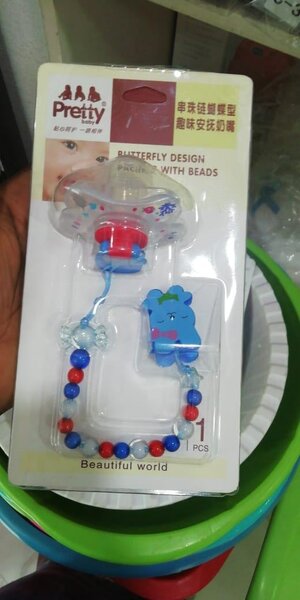 Sucette avec attache perles