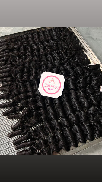 Extensions bouclées en cheveux naturels