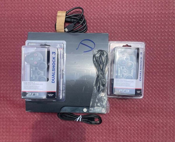 PS3 slim + 20 jeux + 2 manette