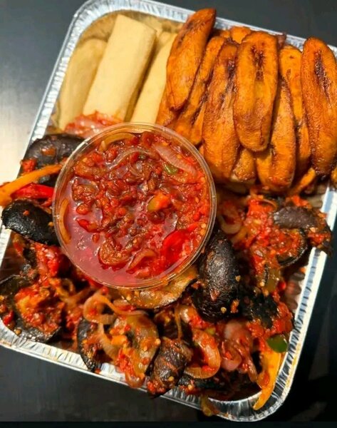 Fried yam and peppered snail and beef