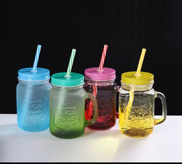 Glass cup with straw