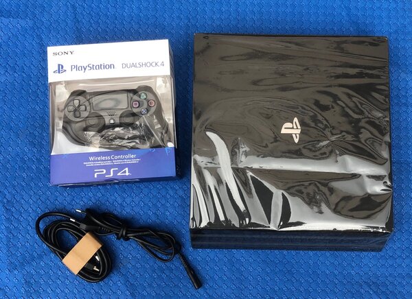 PS4 pro Craquée + 1 Manette + 20 Jeux en promo