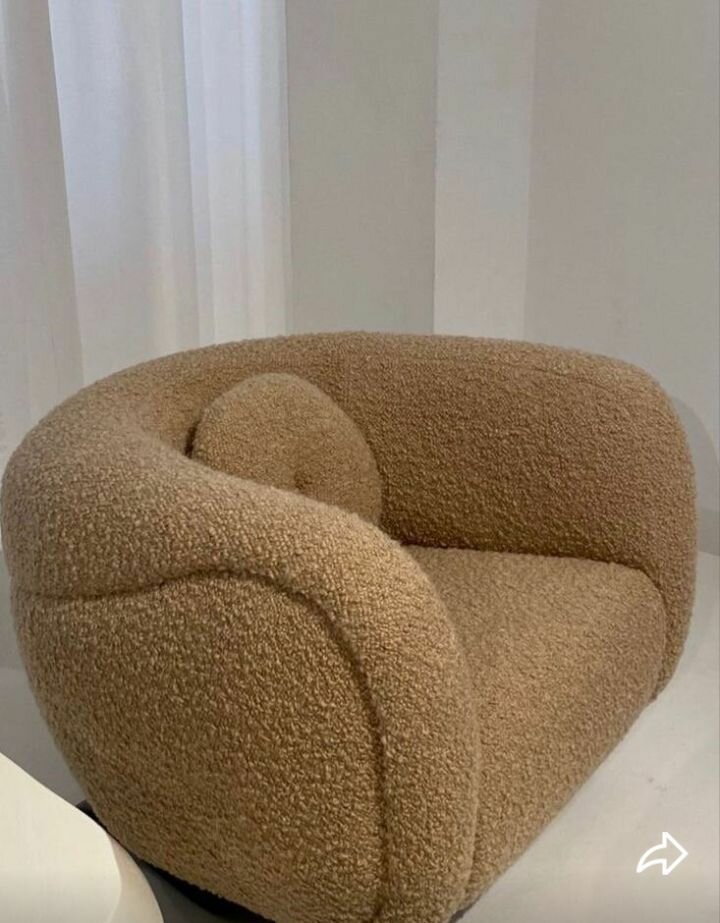 Fauteuil rotatif en tissu bouclé