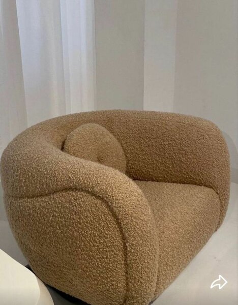 Fauteuil rotatif en tissu bouclé