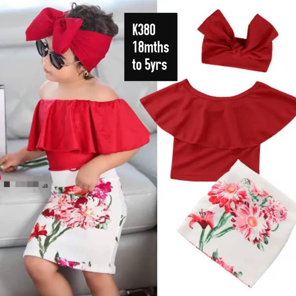 red top, printed skirt and red headband