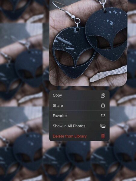 'Acrylic black alien head symmetrical earrings'