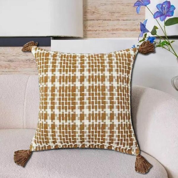 Coussin décoratif à pompons