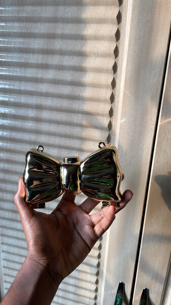 Sac pochette nœud doré