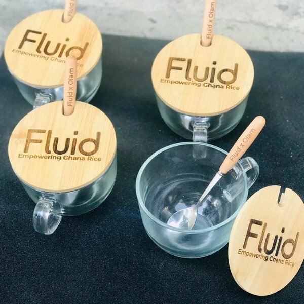 Glass mug with wooden lid and sooon