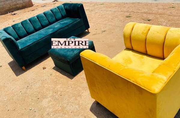 Turquoise sofa and ottoman, and yellow armchair