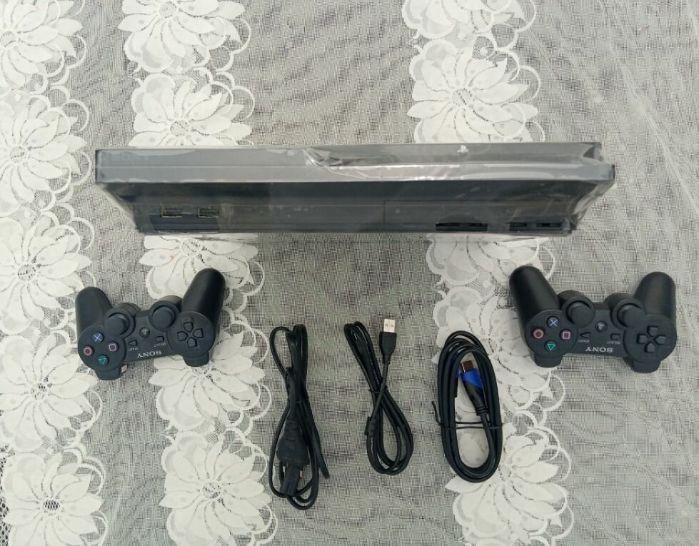 PS3 slim craquée avec 20 jeux