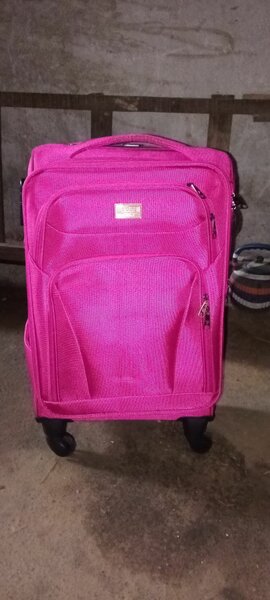 Valise à roulettes rose
