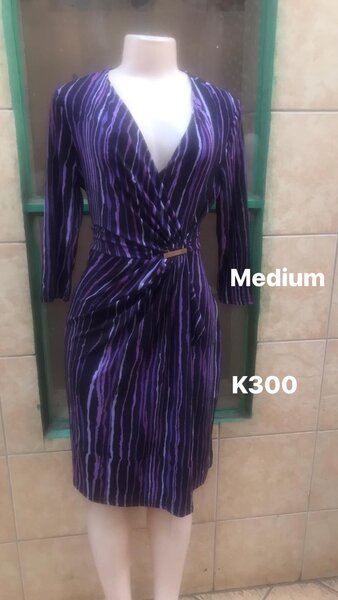 Women's striped dress with a deep neckline