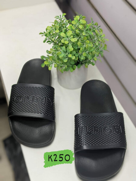 Tommy Halfyger's black slippers