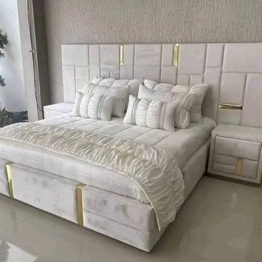 white bed with soft headboard