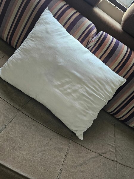 Pillow stuffed with cotton for comfortable sleep