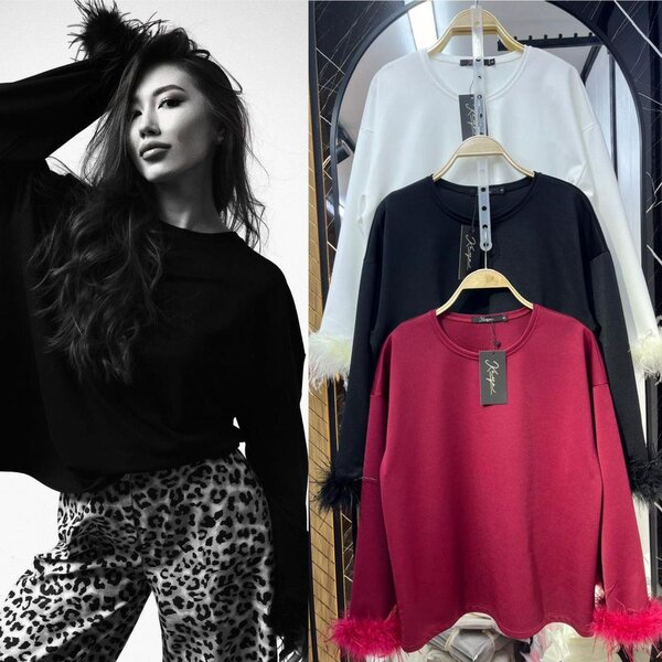 Блузка с перьями