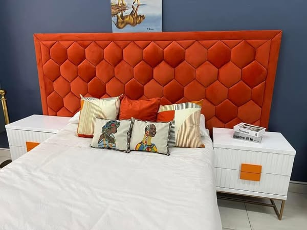 bed with orange headboard