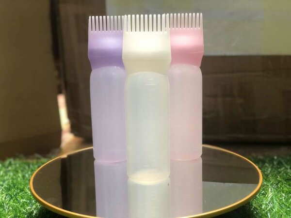 Applicateur d'huile de cheveux