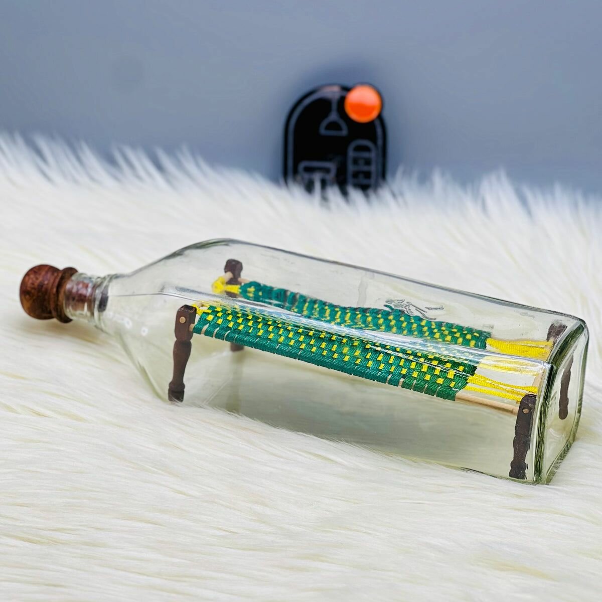 Charpai in Glass Bottle Decor.