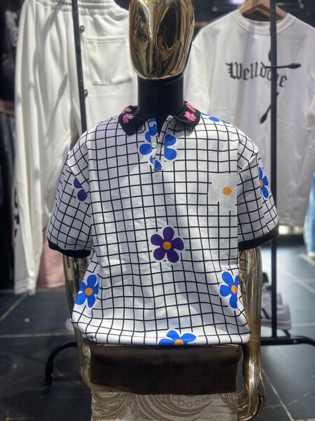 Polo chemise à motifs floraux