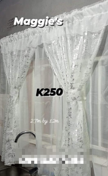 white kitchen curtains with a shiny pattern