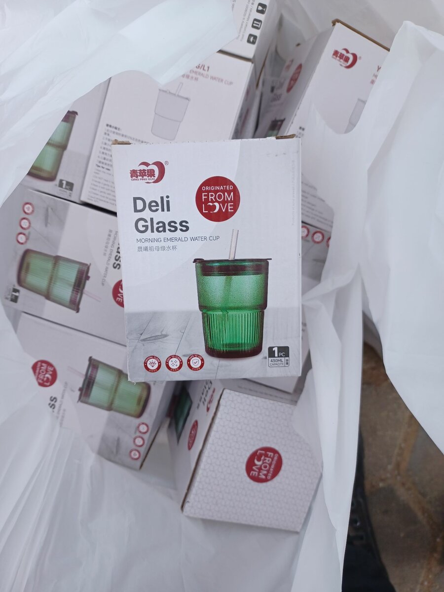 Glass cup with straw