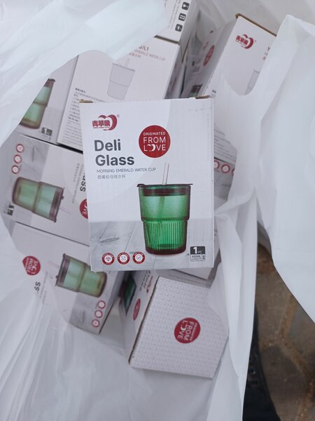 Glass cup with straw