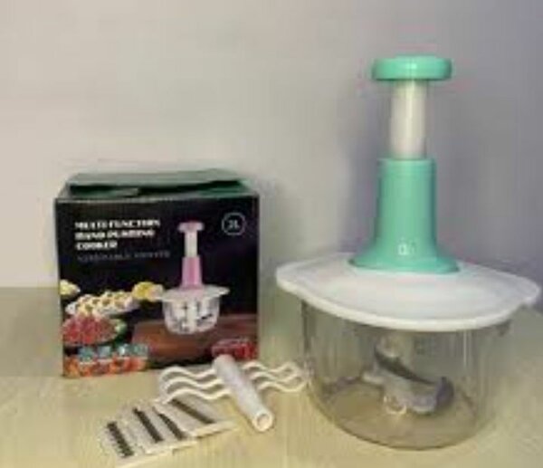 Hand pushing vegetable grater