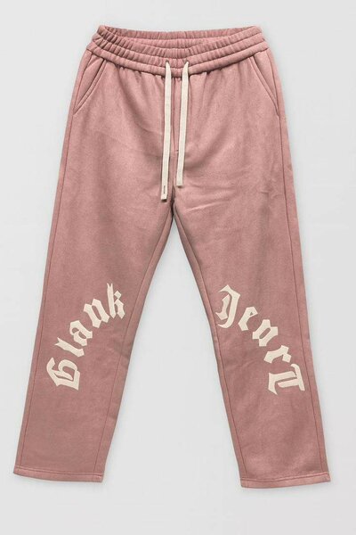 Pantalon sweat rose à imprimé