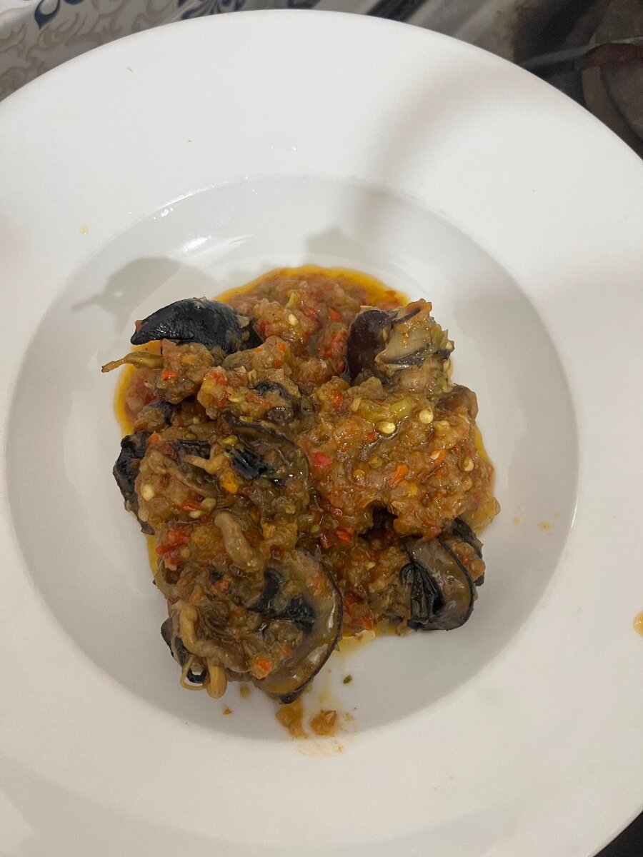 Escargots épicés en sauce