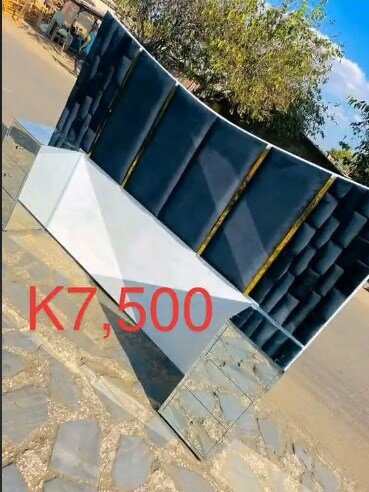 The headboard of the bed is blue and white, soft