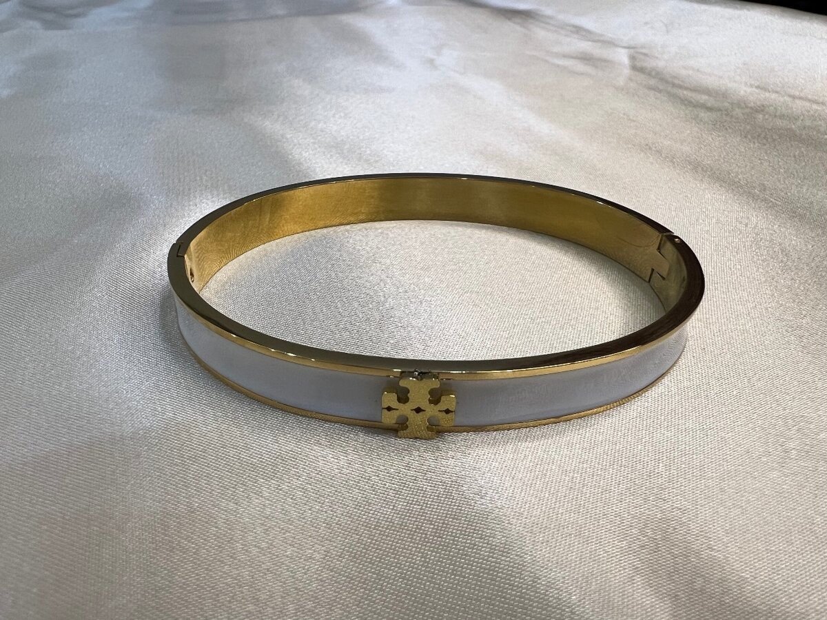 White and gold handcuff for girls.