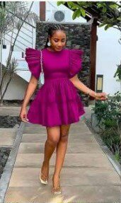 The dress is lilac, the sleeves and hem are multi-layered