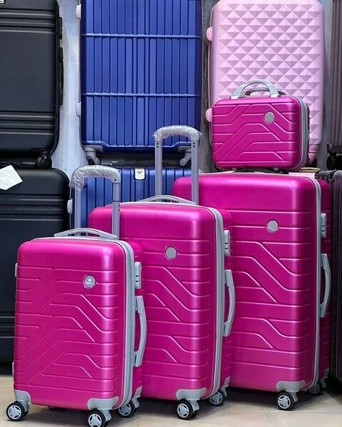 Valise rose ABS rigide sur roulettes