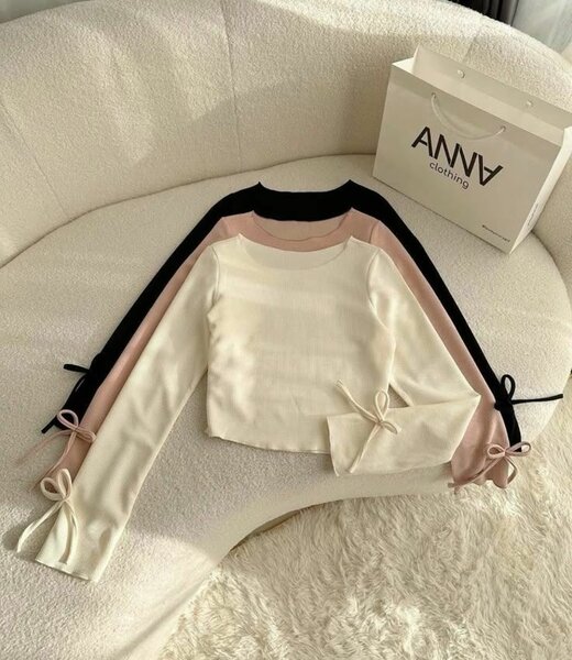 Pull en tricot manches nœud