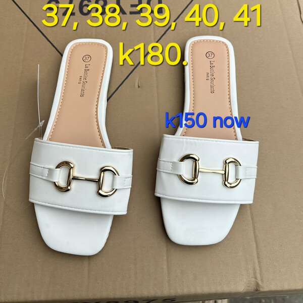 White patent leather flip-slops with gold hardware