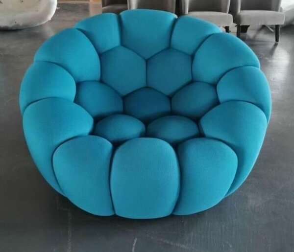 Fauteuil rond bleu sarcelle capitonné