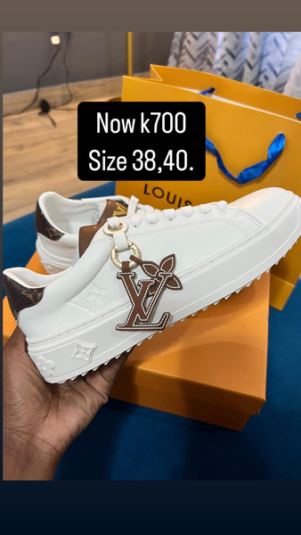 white and brown YSL sneakers