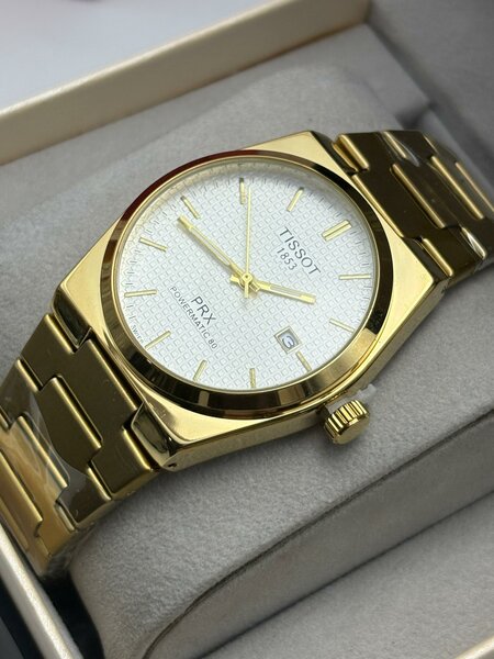 Montre Tissot PRX dorée