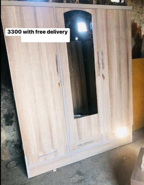 Beautiful beige wardrobe with mirror