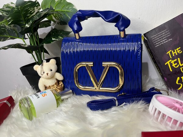 Ladies blue bag with long strips