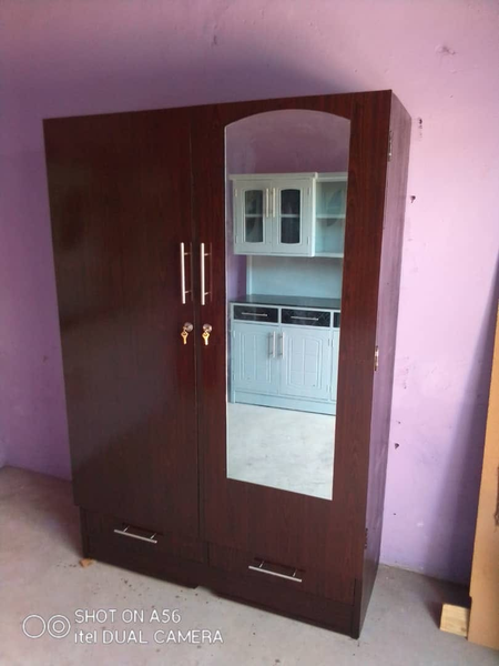 brown cabinet two lines with a mirror