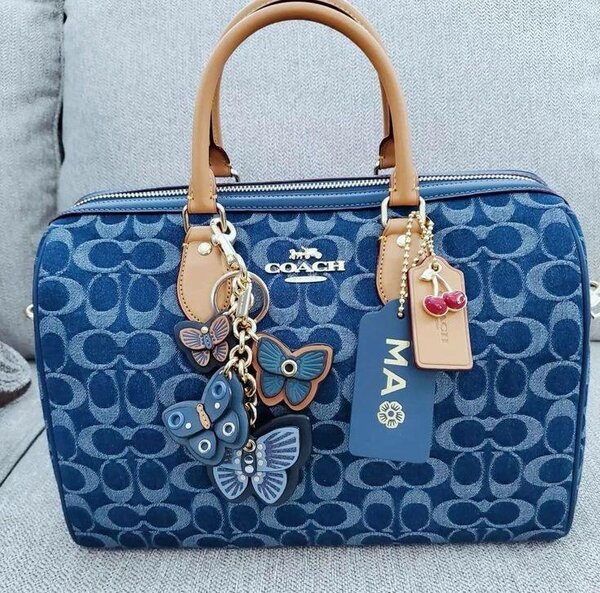 Sac à main COACH bleu avec papillons